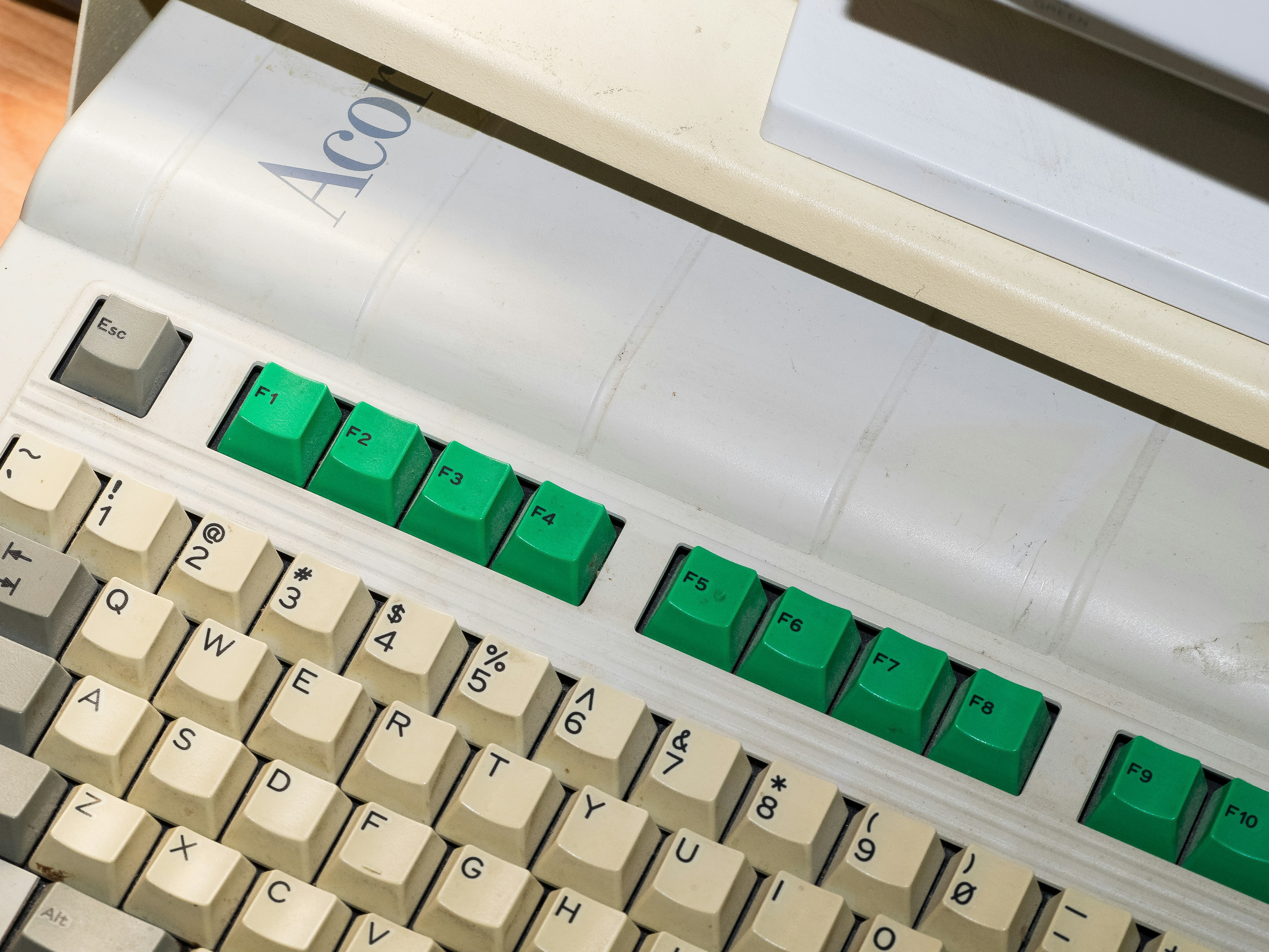 Close-up of a keyboard with green backlit keys